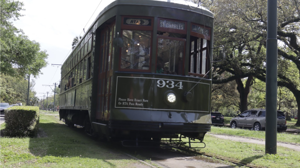 A streetcar drives down St. Charles.